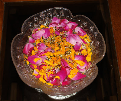 Flower petals in water container