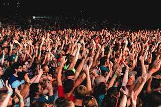 Crowd of people with raised hands