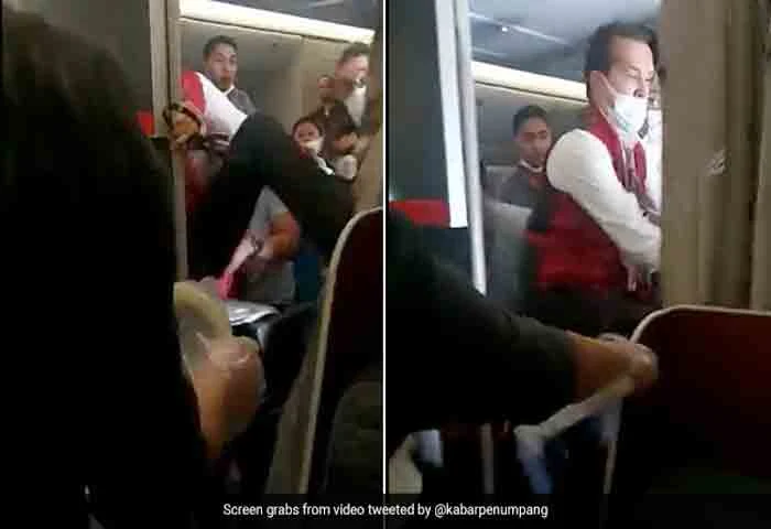 News,World,international,Indonesia,Flight,Travel,Liquor,Police,attack, Video: Drunk Passenger Bites Flight Attendant's Finger