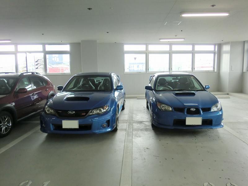 2011 STi vs 2009 WRX New Subaru Impreza STi next to hawkeye Impreza WRX