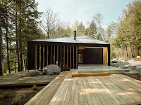 Trapezoidal Vacation Cottage Design with Black and Golden Shaped Concept
