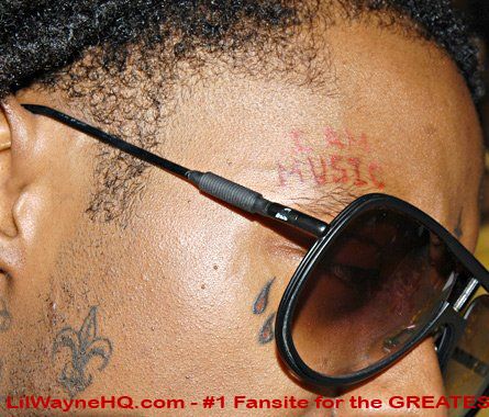 see his'I Am Music' and his'Fleurdelis' New Orleans symbol tattoos