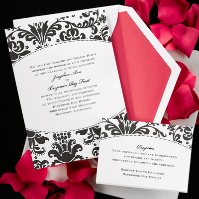 This white card invitation features a black and white embossed floral design