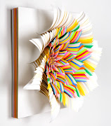 The artist Jen Stark works with stacked paper, cutting into the layers to . (coriolis effect)