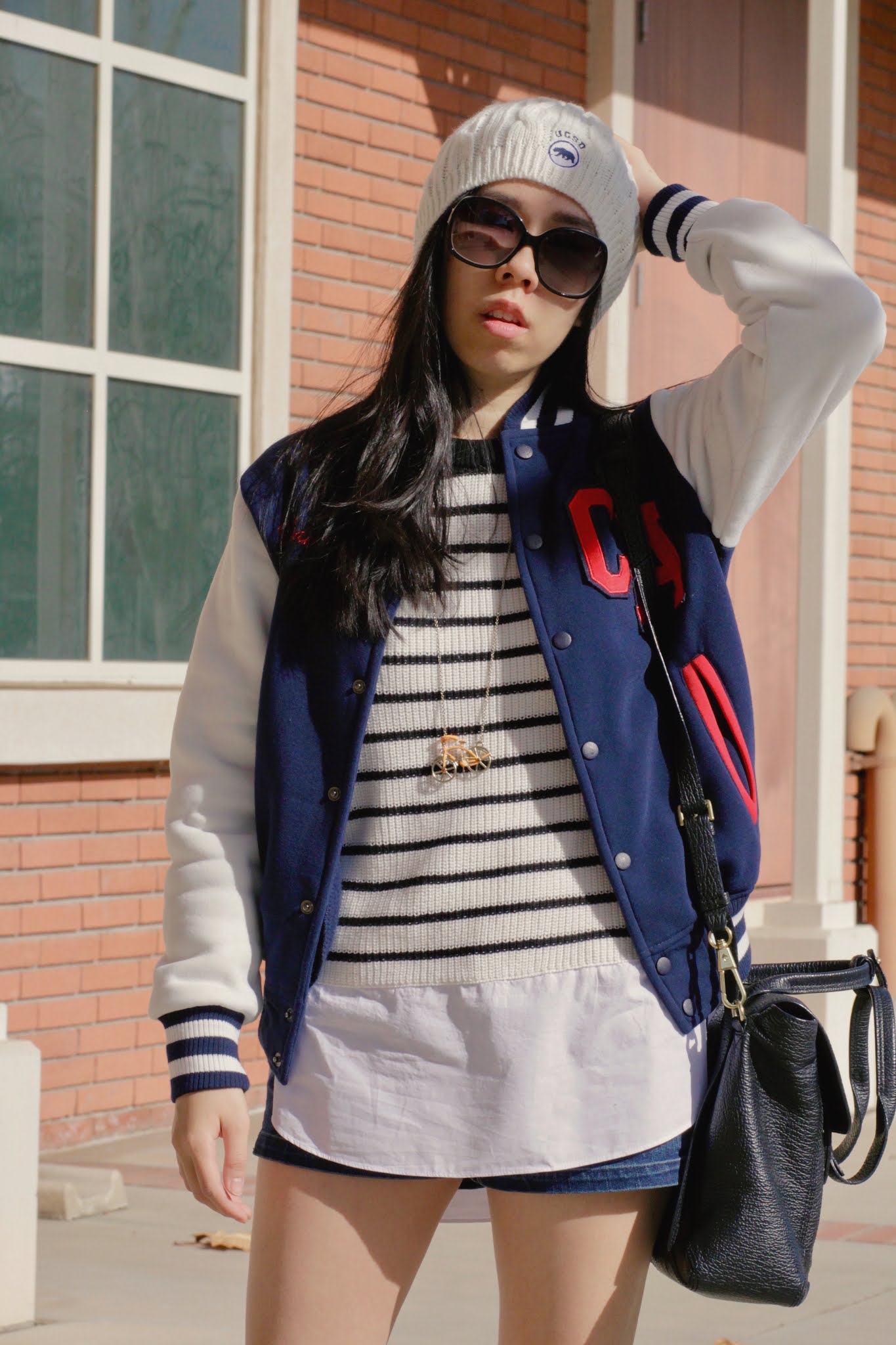 Black and White Sweater with Blue and White Varsity Jacket and Beanie Outfit Inspo_Adrienne Nguyen