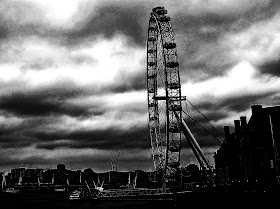 black and white silhouette of the giant ferris wheel called London Eye