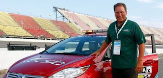 Lupe Marinez Izzo's hubby Tom Izzo with a car