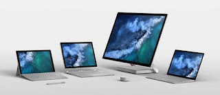 From left: Surface Pro, Surface Book 2, Surface Studio, and Surface Laptop. The Surface Pen is in the foreground on the left, and the Surface Dial in the centre of the foreground.