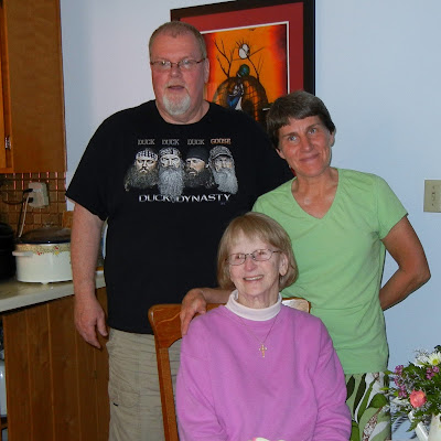 Hubby and me with his mother at her 80th birthday party.