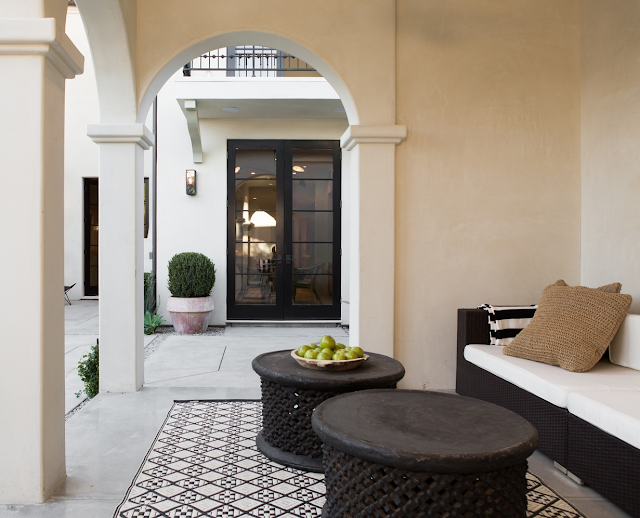 Beautiful patio in villa with European inspired interiors by Leigh Herzig - seen on Hello Lovely