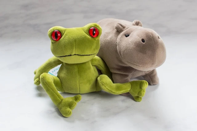 Small green Jellycat frog and small grey jelly cat hippo soft toys