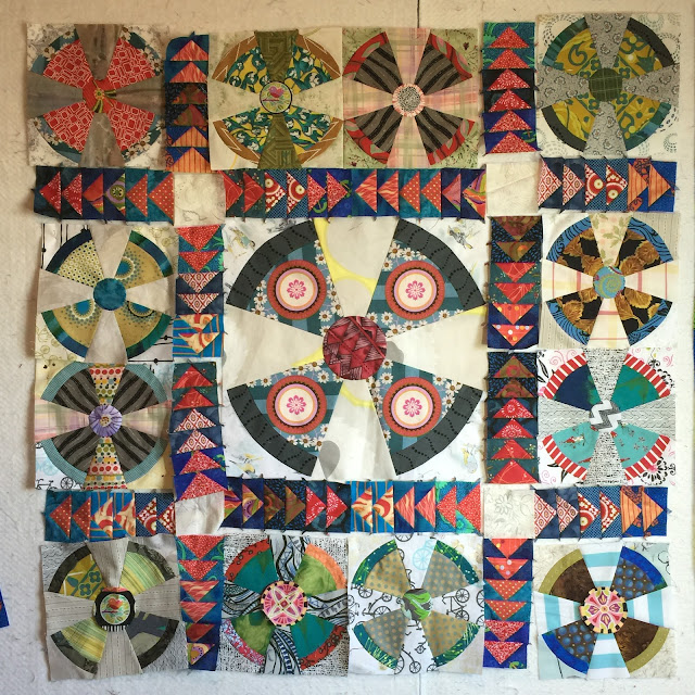 Propeller baby quilt with flying geese sashing