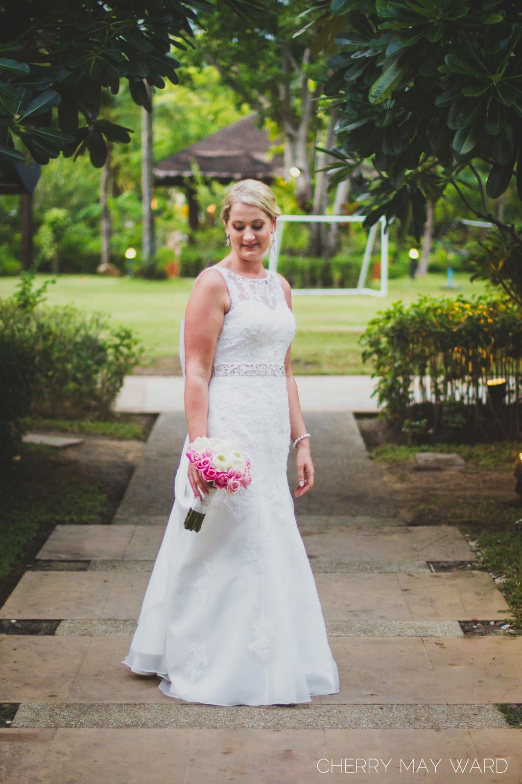 stunning bride, bride photo session, bride holding a bouquet, white wedding gown, after the wedding ceremony