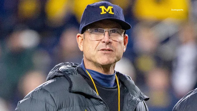 Jim Harbaugh being escorted off the field during a Chargers game