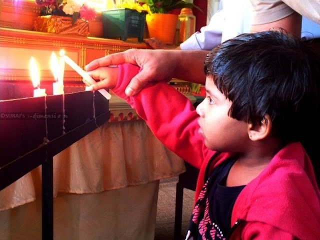 jia prays lighting the candle