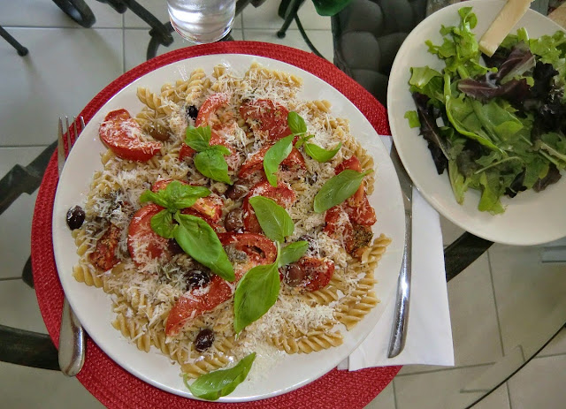 Pasta with roasted tomatoes anchovies and basil