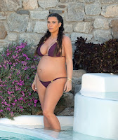 kim kardashian pregnant in a tiny bikini getting in the pool