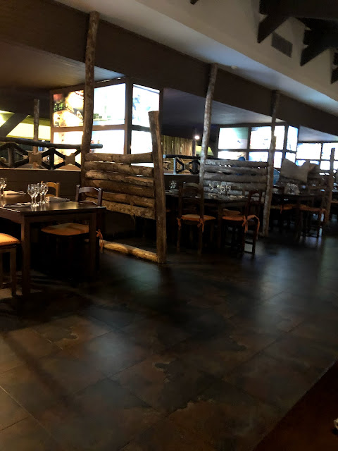 A dimly lit rustic looking restaurant