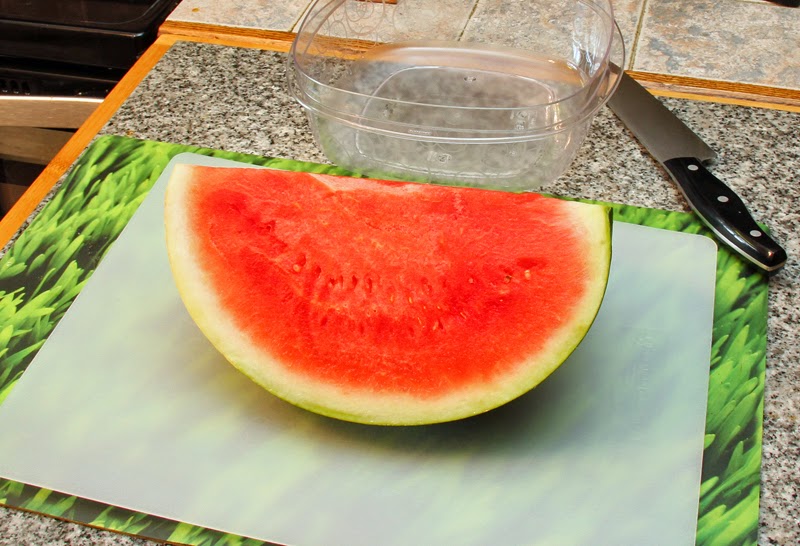 Slice watermelon into quarters