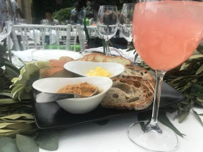 Bread platter with hummus on table decoration of leaves