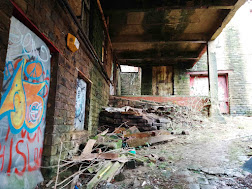 <img src="img_Bailey Mills, New Delph, Manchester Urbex.jpg" alt="Image of passage way to production site">