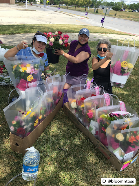 Catherine Costello and volunteers gather gorgeous bouquets to spread joy. Image credit Bloom 'N Toss.