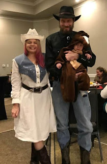 The Nietfeld Family. Maureen dressed up as a rodeo gal, David the cowboy, and Logan their baby horse