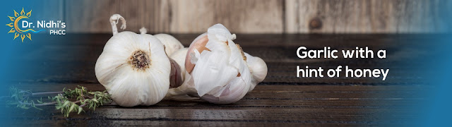 Natural Remedies to treat dandruff : Garlic with Honey