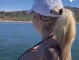 Watch Jessica Cakes shows off a black bikini and white cape as she enjoys the sea view