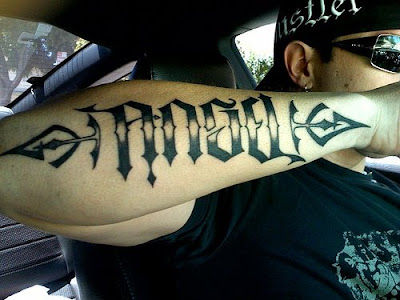 This is a picture of Toryn Green's Angel / Devil Ambigram tattoo in action.