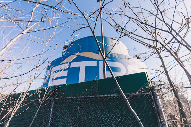 large abandoned blue heating oil tank