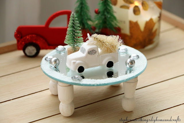 Round mirror riser with mini winter scenery