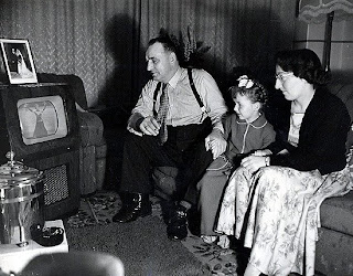 Our household doesn't need your fancy HD television.  Our 1943 Westinghouse is great for watching the Olympics!  (P.S. I'm not really that fat.  And my wife looks better than that.  And we don't have a daughter.)