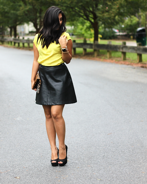 faux leather skirt, yellow satin blouse, leather skirt, a line leather skirt, leopard clutch, clare v, clare v clutch, kat von d vampira