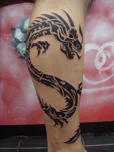 The areas of the body most favoured for tribal dragon tattoos are the arms