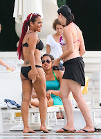 Christina Milian wearing a black bikini