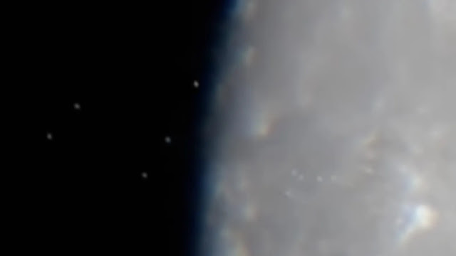 Amateur astronomer has filmed a fleet of UFOs leaving the Moon.