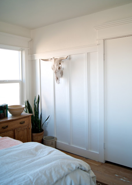 Farmhouse Master Bedroom Reveal - painted BM Simply White - cow skull