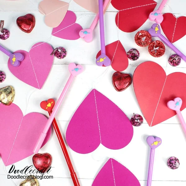 Hearts in reds, pinks and light pinks with pens, candy and Valentine day perfection!