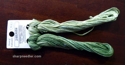 Pair of variegated House of Embroidery threads in greens for border on Herbier by Canevas Folies.