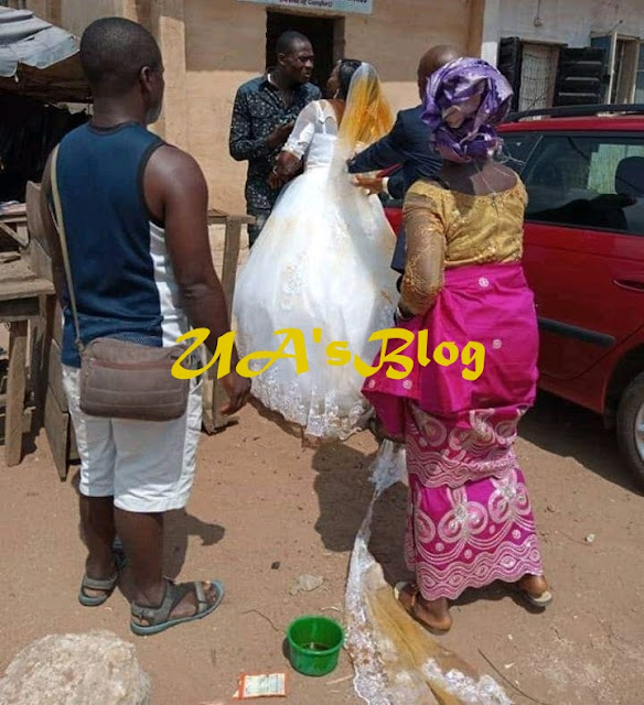 Drama as first wife storms wedding venue and pours red oil on her husband’s new bride’s wedding gown (video)