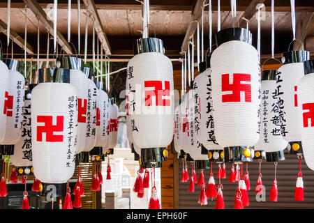 White lanterns with large red swastikas.