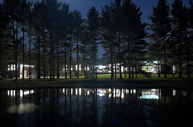 Picture of Clearview Residence by the lake next to the trees as seen at night