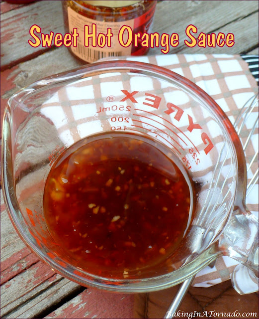 Sweet Hot Orange Sauce, a little sweet, a little spicy, this sauce comes together in minutes. Versatile, you can use it for coating and/or for dipping. | recipe developed by www.BakingInATornado.com | #recipe #sauce