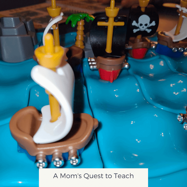 A Mom's Quest to Teach: Pirate Crossfire game pieces and board