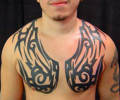 tribal chest piece tattoo at 1046 PM