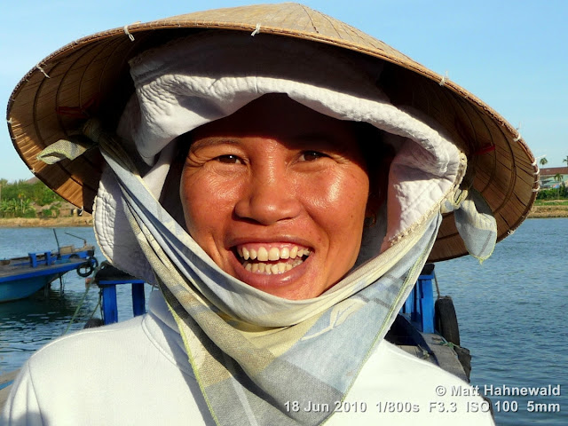 Asian conical hat, conical straw hat, Vietnamese style conical hat, nón lá, sedge hat, rice hat, paddy hat, Vietnamese woman, portrait, headshot, Vietnam, Hoi An