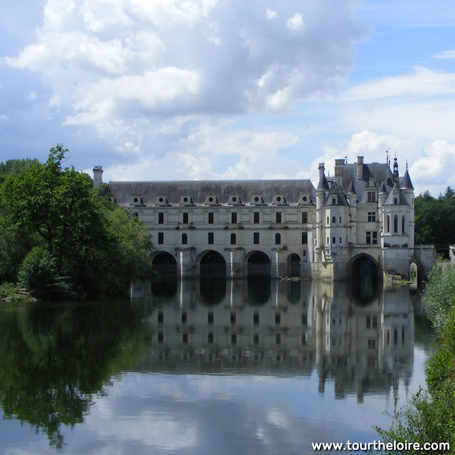 Chateau de Chenonceau reflected in the River Cher during the Covid19 restrictions.  Indre et Loire, France. Photographed by Susan Walter. Tour the Loire Valley with a classic car and a private guide.