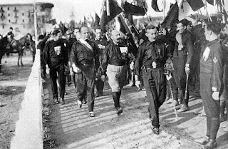 Mussolini (second left) walked alongside Cesare Maria de Vecchi during part of the March on Rome