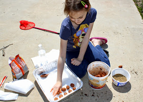 Afterward, she folded over her clay/compost bits and shaped them into balls.